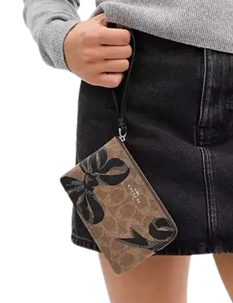 Coach Corner Zip Wristlet In Signature Canvas With Bow Print